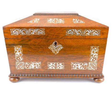 A George IV mother of pearl tea caddy of sarcophagus form, hinged cover enclosing fitted interior, lacking mixing bowl, raise