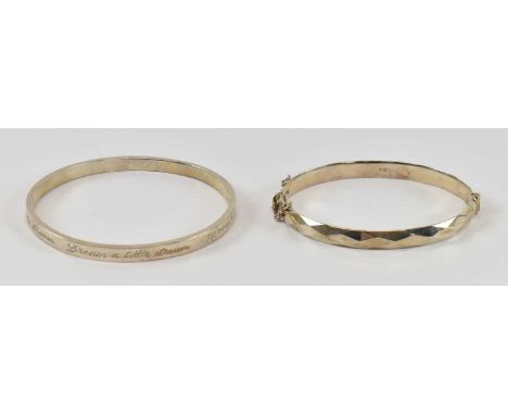 A modern hallmarked silver bangle, London 1973, diameter 5.5cm, together with another 925 hallmarked silver bangle, engraved 