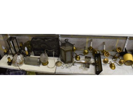 A quantity of light fixtures and fittings including three oak chandeliers, a set of four brass wall lights, cast iron lantern