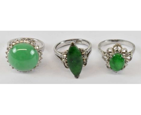 A group of three hallmarked silver rings, all set with green hardstones, sizes J, K and K, combined approx 11.7g. 