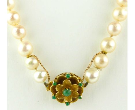 A single strand of cultured pearls with 9ct gold circular clasp in the form of a flower head with green jade beads, with 9ct 