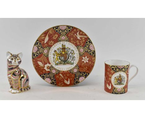 ROYAL CROWN DERBY; an Imari decorated cat paperweight with gold seal mark to base, height 13cm, boxed, a Royal Worcester Quee