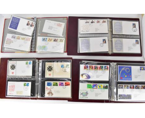 Four albums of mostly 1980s Royal Mail first day covers.