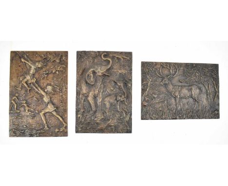 † A group of three heavy bronzed metal plaques, one depicting a stag, another depicting three elephants, and another depictin