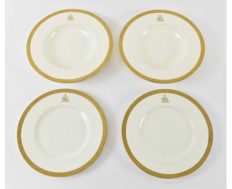 MINTON; a pair of gilt decorated bowls and matching plates, all decorated with the family crest of the Shah of Persia, diamet