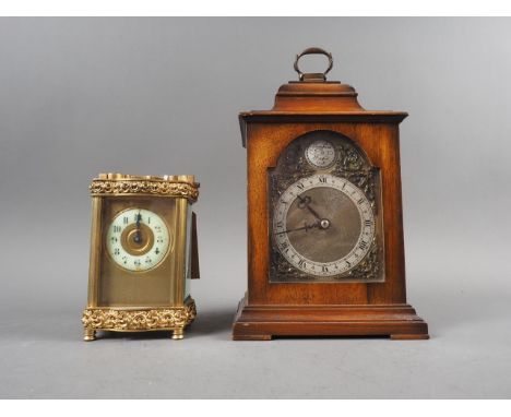 A gilt brass shaped cased carriage clock, 5" high, and a walnut cased mantel clock, 9" high