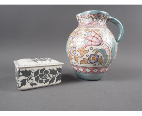A Bursley ware tube lined jug, by Charlotte Rhead, and a similar rectangular trinket box and cover