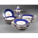 A Coalport style dessert service with floral decoration on a blue and gilt ground