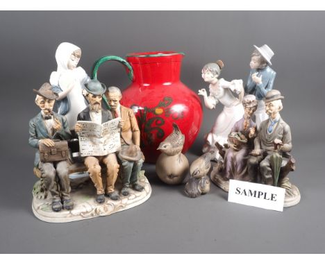 Two Nao figures, two Capodimonte figure groups, two Poole Pottery model birds, a red glazed jug and other items