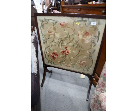An Edwardian mahogany framed fire screen with silk embroidered panel, 24" wide, and a smaller mirror panel fire screen, in wh