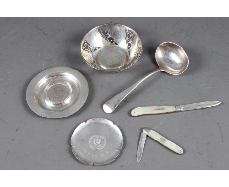 A silver bonbon dish with pierced decoration, 4 1/4" dia, two silver coin dishes, a sauce ladle and two abalone and silver bl
