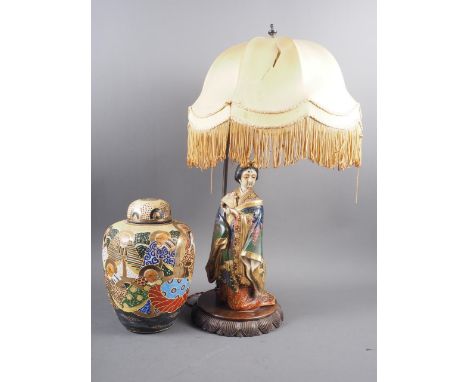 A 1930s table lamp with Satsuma figure of a geisha and adjustable height shade, on hardwood stand, 23" high, and a Satsuma gi