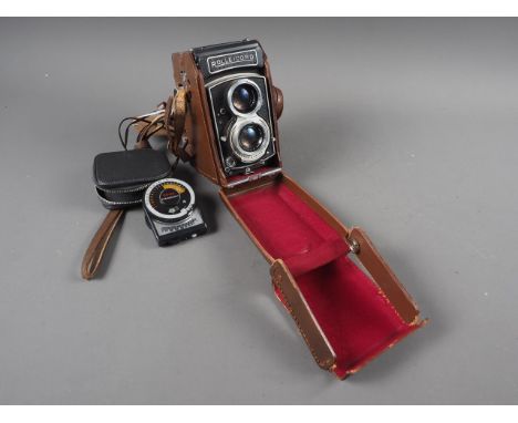 A Rollicord twin lens reflex camera, in case, and a light meter