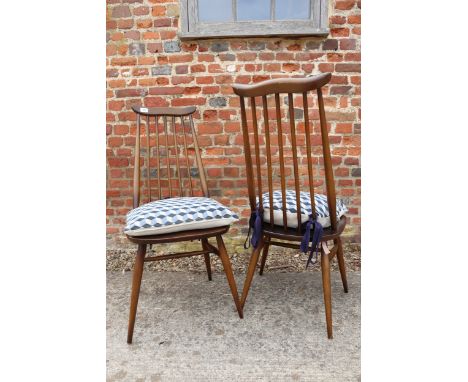A set of four Ercol "Goldsmith" spindle back dining chairs