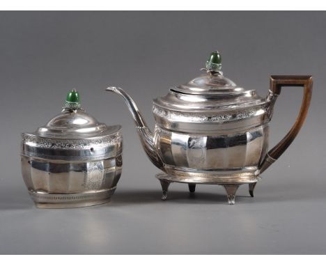 A Georgian bright cut silver fluted oval teapot with green stained ivory finial and mahogany handle, 16oz troy gross, the sta