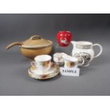 A Bridgwater Jersey cream jug, a Royal Crown Devon Pegasus tea caddy and cover, a floral tea