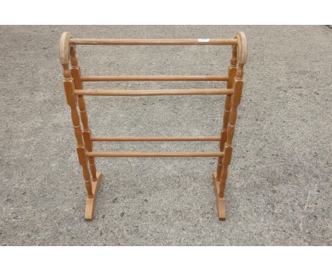 A pine towel rail, a folding clothes airer, an oak framed firescreen and a pine framed wall mirror