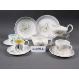 A Susie Cooper "Blue Orchid" part combination service, and five Susie Cooper bone china coffee