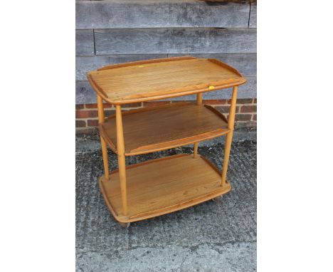 An Ercol three-tier trolley, on shepherd castors, 28" wide x 18 1/4" deep x 30 1/2" high and a&nbsp;19th century mahogany bow