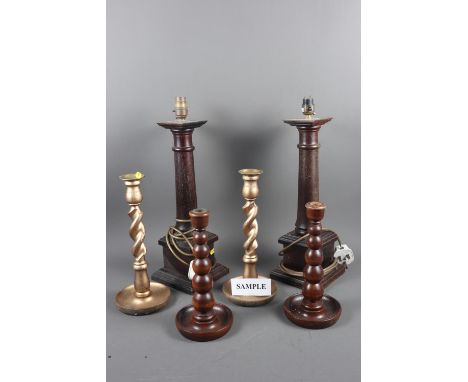 1 pair of wooden column table lamps, two pairs of candlesticks, a ceramic bracket light and other lighting
