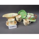 A quantity of Clarice Cliff and Carlton Ware china, including teacups, saucers, shaped dishes, etc