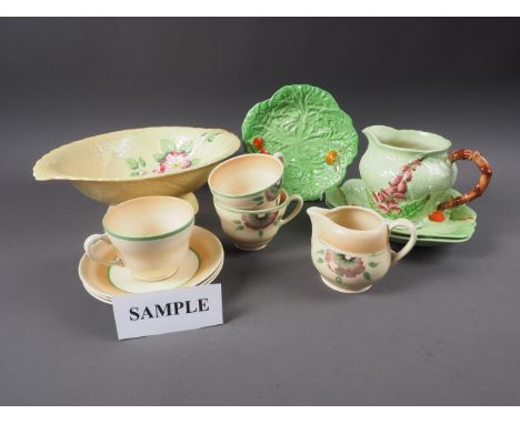 A quantity of Clarice Cliff and Carlton Ware china, including teacups, saucers, shaped dishes, etc
