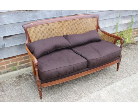 A Louis XVI design mahogany two-seat double bergere settee, total width 54" x 24" deep x 34" high, seat height without cushio