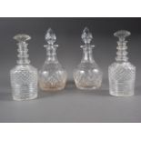 A pair of three ring neck cut glass decanters and stoppers, 8 1/2" high, and a similar pair of