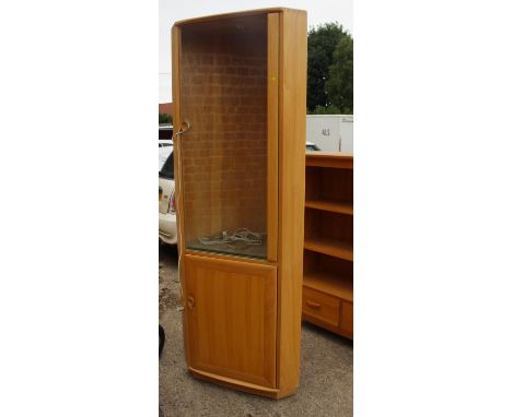 An Ercol light oak corner display cabinet with glazed door over cupboard, 28 1/2" wide x 18" deep x 77" high