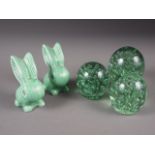 Three 19th century dump paperweights, largest 5" high, and two Sylvac rabbits, 5 1/2" high