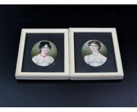 A pair of early 19th century oval portrait miniatures on ivory, each depicting a lady, frames measure 11.5cm x 10cm (2)