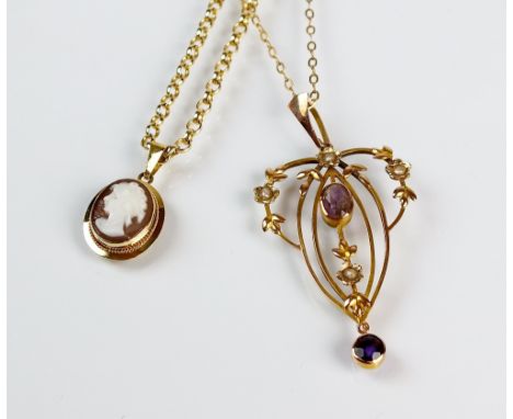 An early 20th century amethyst and seed pearl openwork pendant, with yellow metal chain, stamped '9ct', together with an oval