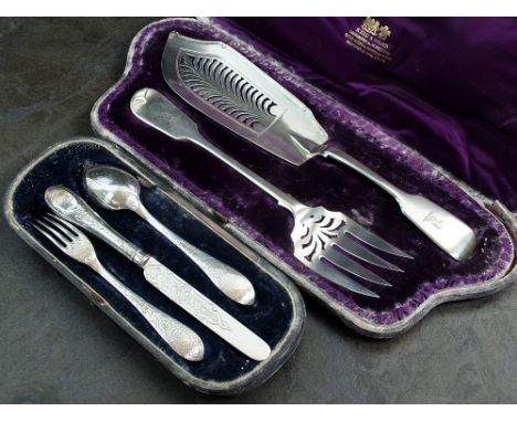 A matched cased set of silver Fiddle pattern fish servers, London 1840 & 1870, together with a cased three piece silver Chris
