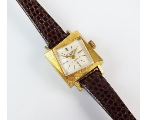 A lady's 18ct gold Unitas wristwatch, the textured square case with white diamond shaped dial with batons, manual wind, with 