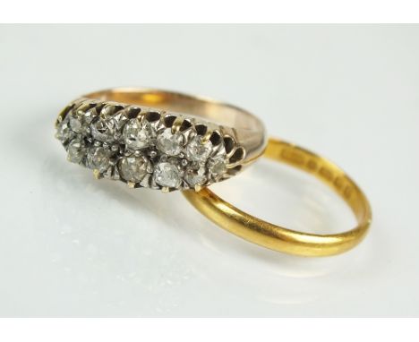 A twelve stone two row graduated diamond set ring, the old cut diamonds claw set in white metal to yellow metal hoop, ring si