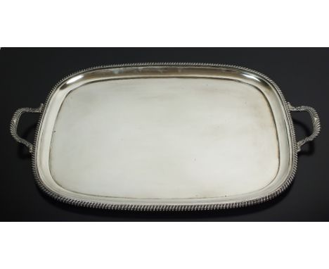 A large two handled silver tray, Harrison Brothers & Howson, Sheffield 1931, of plain polished rectangular form with gadroone