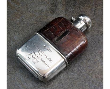 A silver and crocodile skin mounted hip flask, Colen Hewer Cheshire, Chester 1920, the rectangular glass flask with silver to