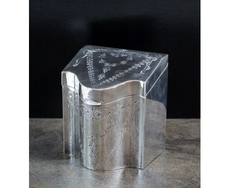 An Edwardian silver tea caddy, Alfred Marston, Chester 1909, of rectangular bow fronted form with engraved scroll, swag and f