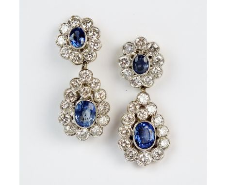 A pair of early 20th century style 18ct gold sapphire and diamond ear pendants, each designed as an oval mixed cut sapphire a