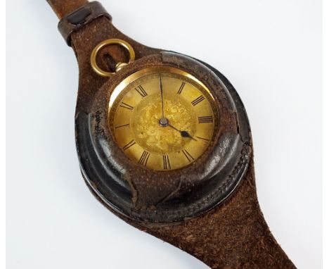 A lady's continental yellow metal open face fob watch, the champagne dial with black Roman numerals, gilt movement not signed
