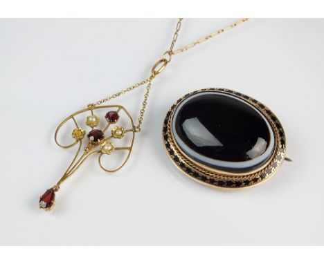 A garnet and seed pearl openwork pendant, together with a banded agate and enamel oval mourning locket (at fault) (2)