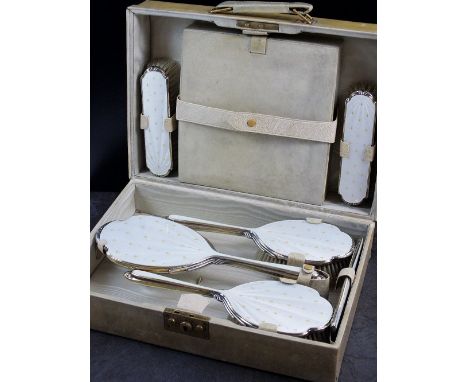 A cased silver and guilloche enamel dressing table set, Albert Carter, Birmingham 1947, each piece with cream guilloche ename