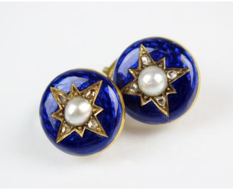 A pair of diamond, enamel and split pearl set dress studs, each designed as a circular blue enamel plaque with central split 