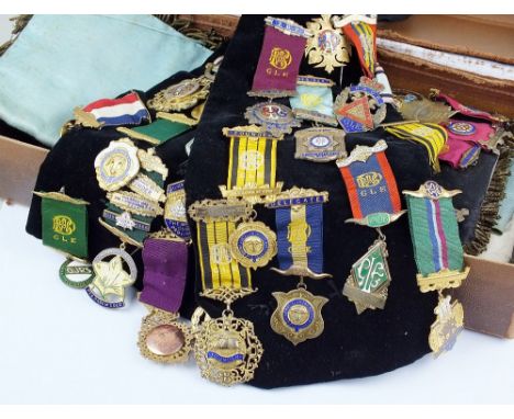 A suitcase containing a large quantity of Masonic regalia, R.A.O.B, to include; sash, apron, gloves, two 9ct gold medals, nin