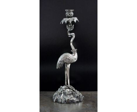 A 19th century silver plated stork candlestick, naturalistically modelled as a stork supporting leaf moulded sconce and raise