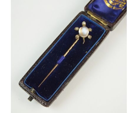 A moonstone and diamond set turtle stick pin, designed as a cabochon oval moonstone 'body' with rose cut diamond set head and