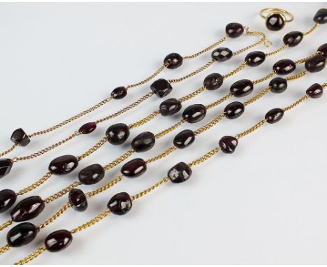 A 19th century garnet set guard chain, the plain polished and faceted garnet baroque beads set to yellow metal curb link chai