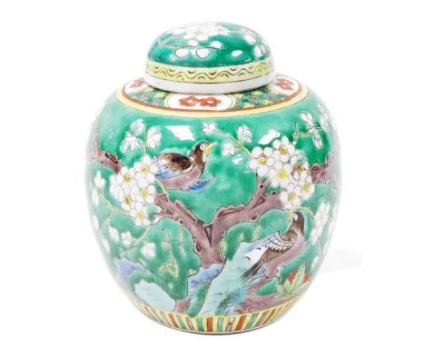 A 19th/ 20thC Chinese porcelain green enamelled ginger jar and cover, decorated with birds and prunus blossom, with hatched a