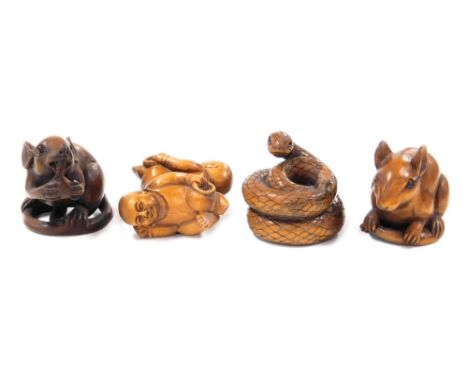 Four Oriental carved wooden netsuke, comprising mouse, 4cm high, rat holding a piece of fruit, 4.5cm high, coiled snake, 4cm 