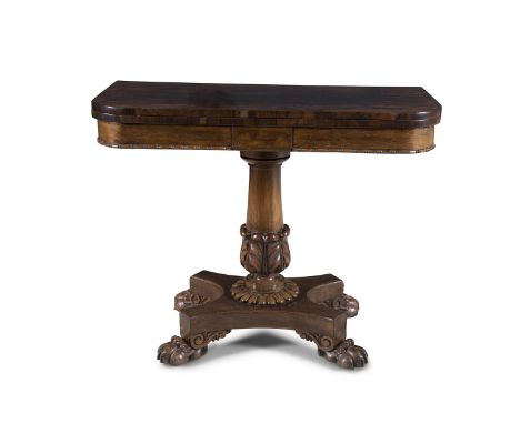 A GEORGE IV ROSEWOOD FOLD-OVER CARD TABLE, the rectangular top with rounded corners enclosing a baise lined interior, over a 